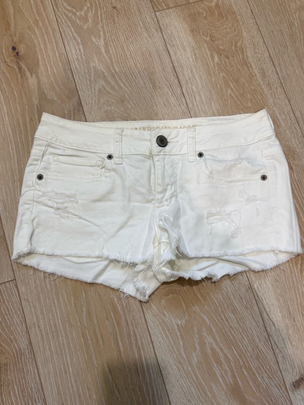 American Eagle Outfitters Cream Distressed Low-Rise Denim Shorts